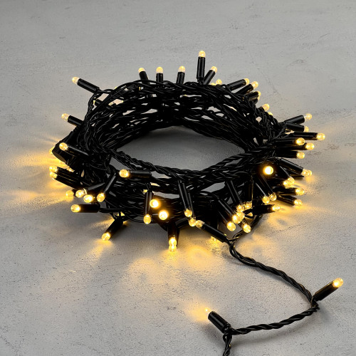 Светодиодная гирлянда с колпачком 100 теплых белых LED ламп 10 м., 24В., черный провод ПВХ, IP65, LTC (PST100CAP-11-1WW)