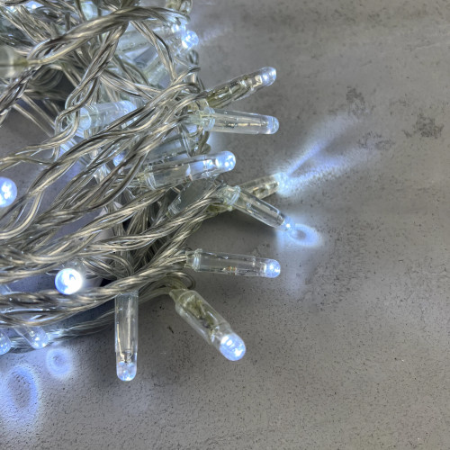 Светодиодная гирлянда с колпачком 100 холодных белых LED ламп 10 м., мерцание, 24В., прозрачный провод ПВХ, IP65, LTC (PST100BLWCAP-10-1W)