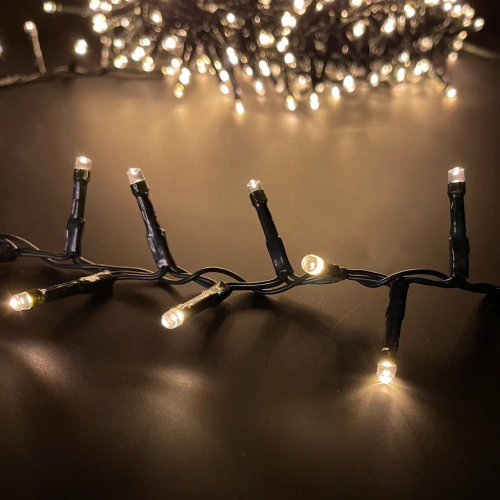 Светодиодная нить Snake Light 700 теплых белых ламп, 14 м., 24В, 8 режимов, зеленый провод, для елки 215 см., Christmas DeLuxe (83782)