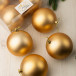 Набор пластиковых шаров Глория 100 мм., золотой матовый, 4 шт., ЕлкиТорг (150401) в Санкт-Петербурге